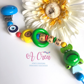 Pacifier clip with name 'blue, yellow, green 3D frog'